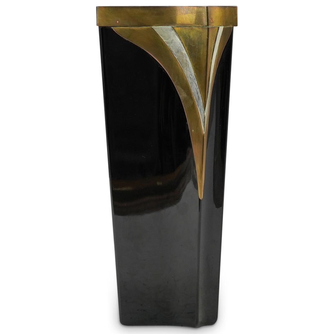 "Dara International" Bronze & Glass Vase: DESCRIPTION: A "Dara International" 1980's vase. Features a black glass foundation with bronze mounted accents. Label attached "1983, Dara International accessories Ltd. Chicago, Illinois" CIRCA: 20th