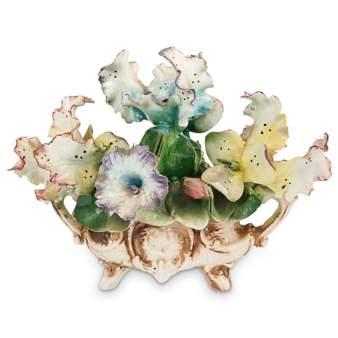 Vintage Capodimonte Porcelain Flower Centerpiece: DESCRIPTION: Vintage Capodimonte Porcelain Flower Arrangement Centerpiece. Featuring dusty yellow and blue orchid flowers and other different colored flowers and leaves. Marked at bottom "Capodimonte"