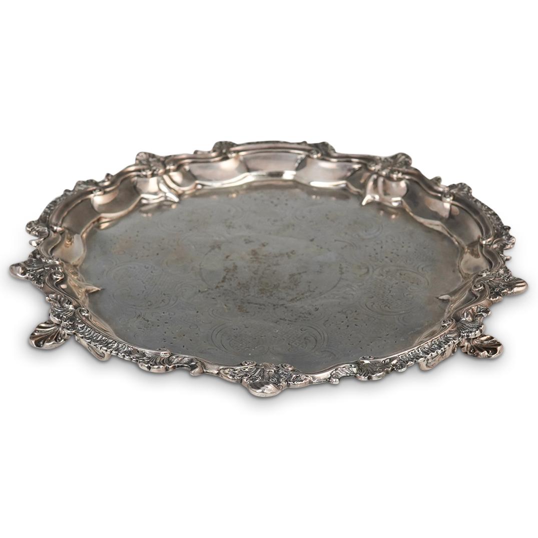Antique English Georgian Era Sterling Silver Tray: DESCRIPTION: An antique English Georgian era sterling silver tray etched along the surface with baroque absinthe vine motifs, completed with four curling orante feet. Stamped with the Lion passant and