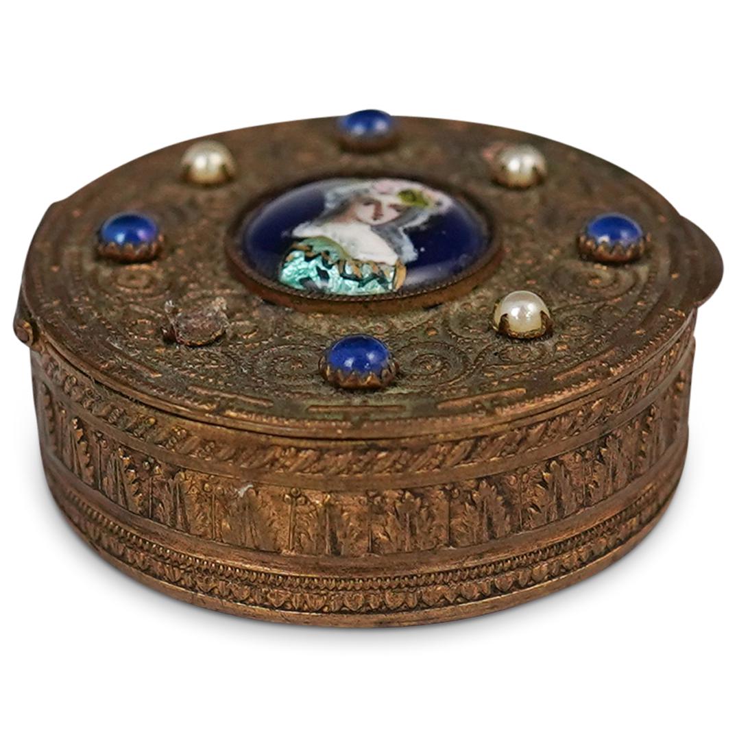 Antique French Filigree Powder Box: DESCRIPTION: An antique French powder box with filigree and center portrait designs. Finished with mounted semi-precious stones an interior mirror and powder puff. Stamped: "Made in Paris" underneath.