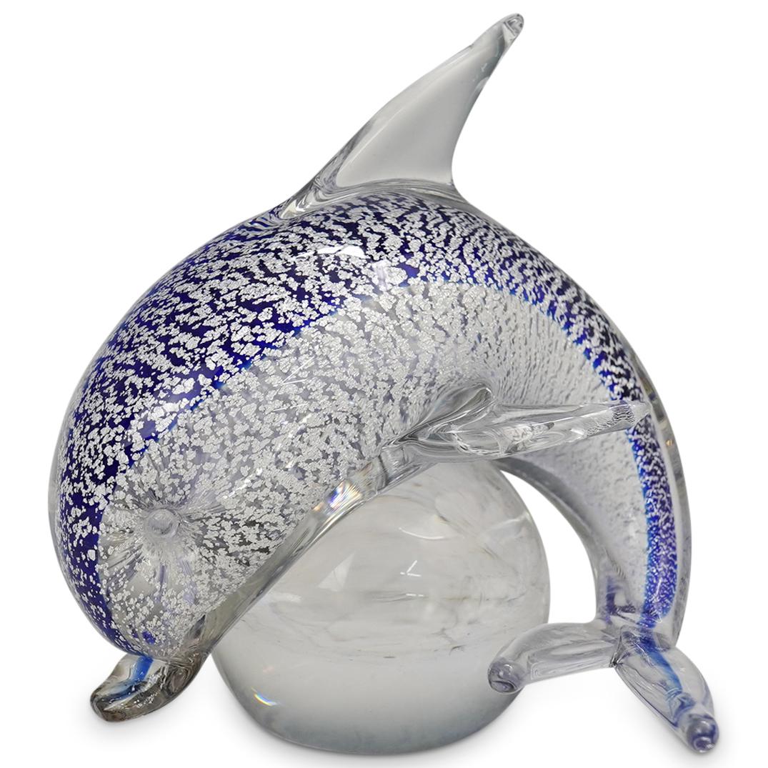 Murano Glass Silver Flake Dolphin Paperweight: DESCRIPTION: A Murano blown glass paperweight with silver speckled blue dolphin design. CIRCA: 20th cent. ORIGIN: Italy DIMENSIONS: H: 5.5" x D: 6" CONDITION: Great condition. See lot description for 