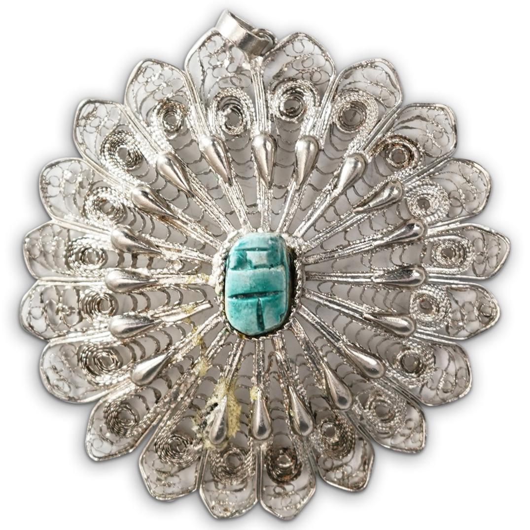 Silver Egyptian Style Scarab Pendant: DESCRIPTION: A sterling silver Egyptian style scarab pendant with openwork filigree designs. CIRCA: 20th Cent. ORIGIN: Continental DIMENSIONS: D: 3.5" Total Weight: ? CONDITION: Great condition. See l