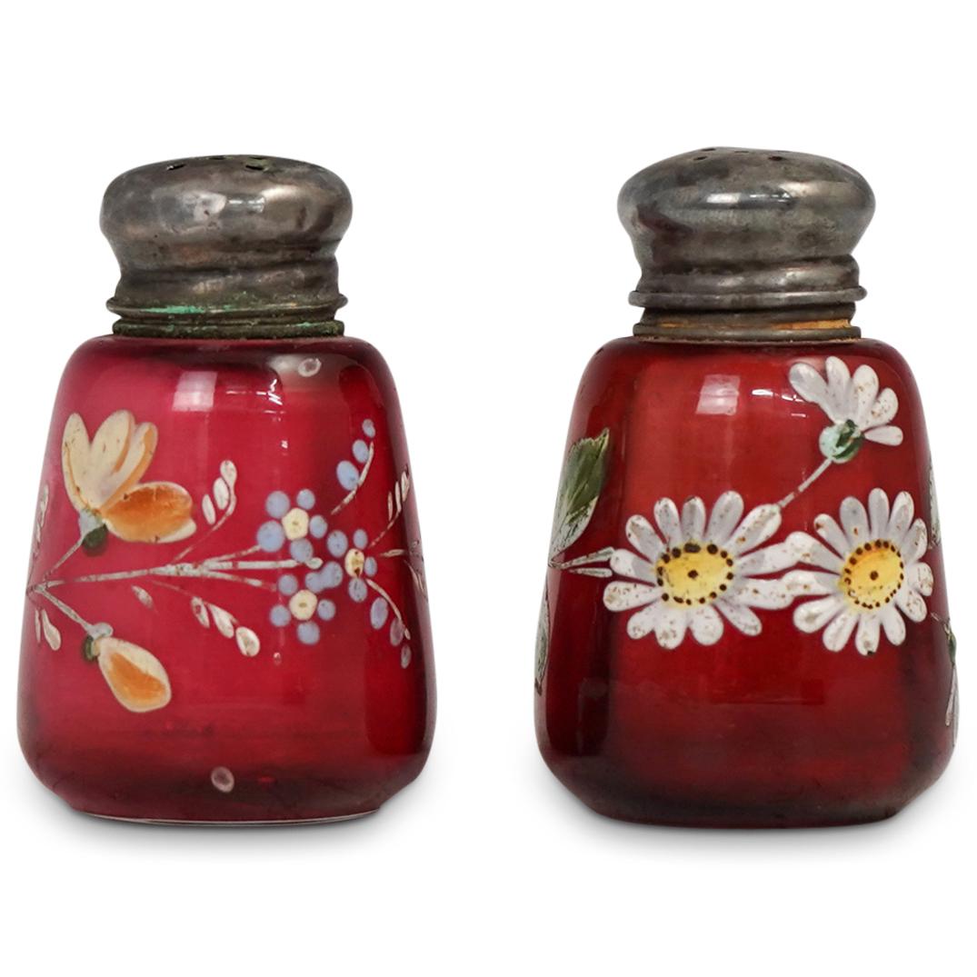 Floral Painted Glass Salt & Pepper Shakers: DESCRIPTION: Silver topped glass salt and pepper shakers with hand painted floral decorations. CIRCA: 20th Cent. ORIGIN: USA DIMENSIONS: H: 2.75" x D: 1.75" CONDITION: Great condition. See lot descrip