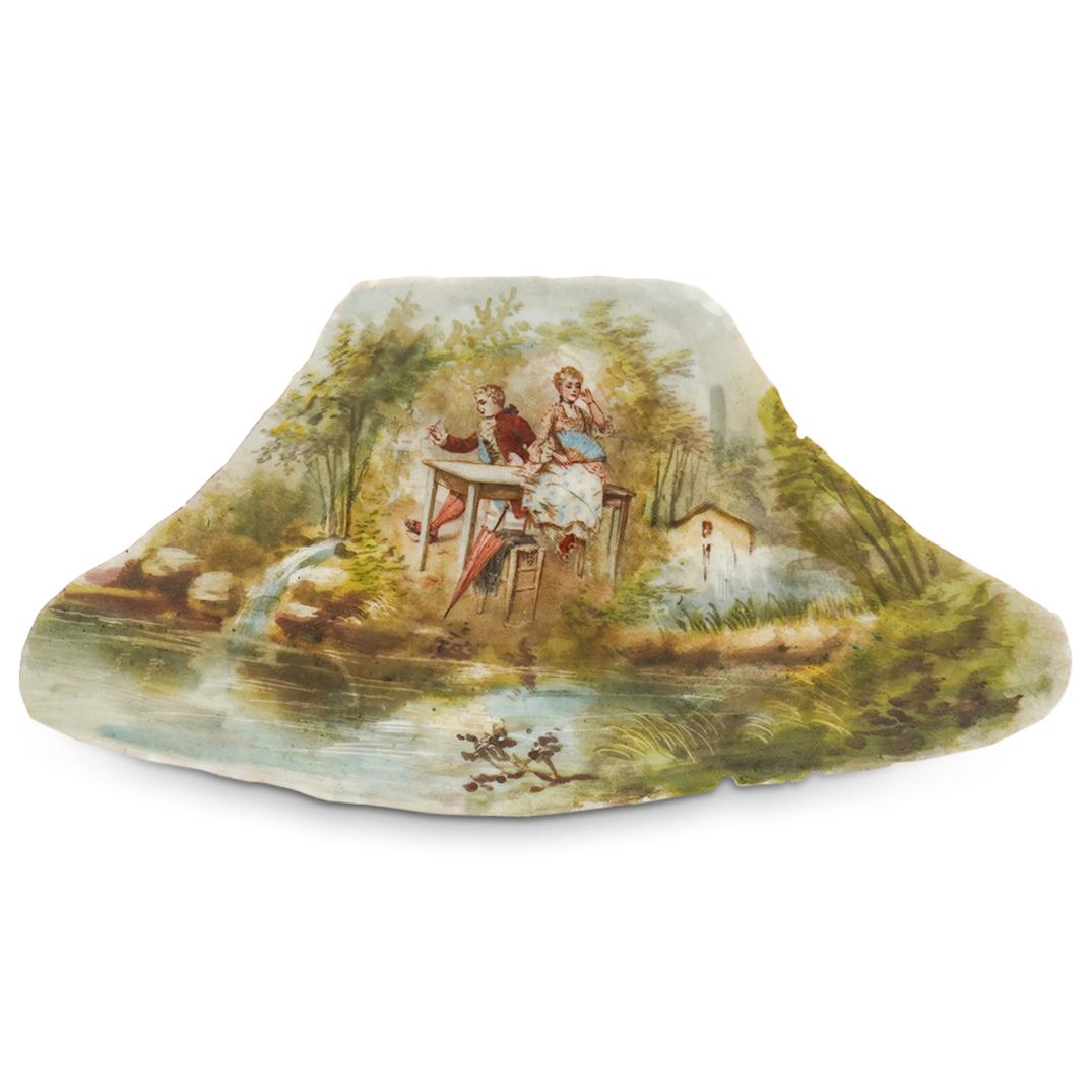 French Hand Painted Porcelain Tableau: DESCRIPTION: French Hand Painted Porcelain Tableau depicting a picturesque scene of romantic couple in landscape by the river. The hand painted scene is painted on an irregular piece of porcelain mark