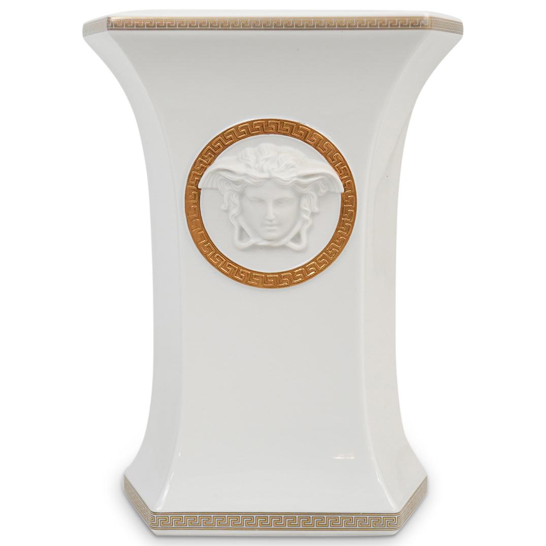 Versace Rosenthal "Gorgona" Vase: DESCRIPTION: A Rosenthal Versace "Gorgona" medusa line white porcelain vase decorated with Versace signature medusa motif on both frontal and back sides. Hexagonal vase with frontal medusa in golden f