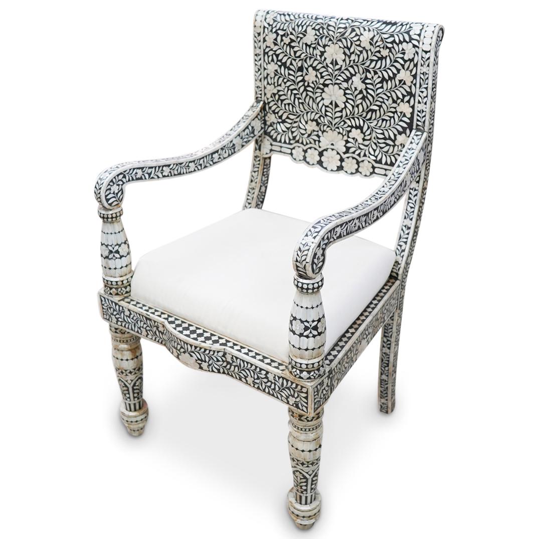 Vintage Mother of Pearl Inlaid Armchair: DESCRIPTION: A vintage Indian arm chair with intricate inlaid mother-of-pearl designs throughout. Finished with a cream colored cotton upholstery. CIRCA: 20th Cent. ORIGIN: India DIMENSIONS: H: 40" x 