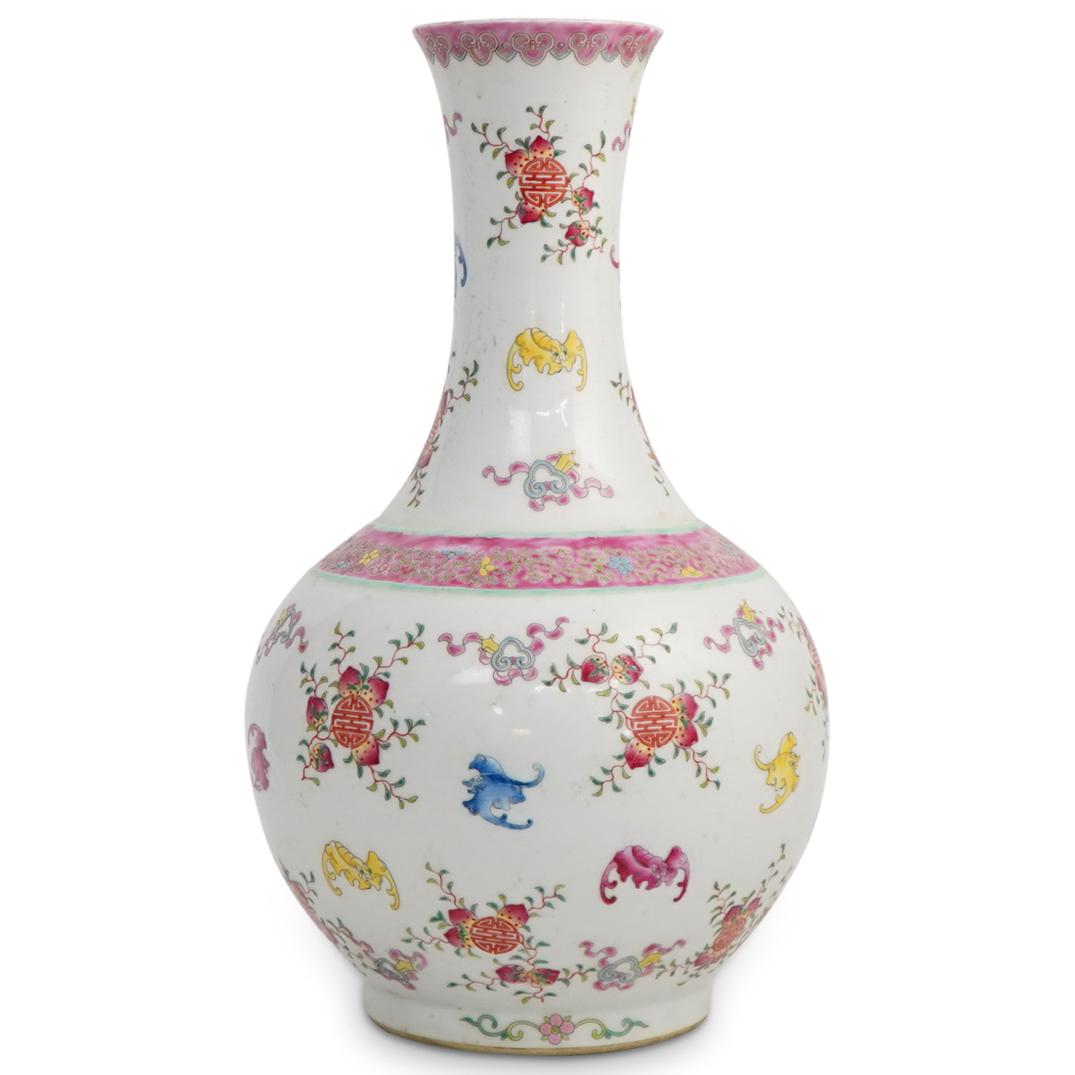 Chinese Famille Rose Porcelain Vase: DESCRIPTION: A Chinese bottle neck formed porcelain vase with famille rose bat, fruite, and floral decorations. Character marking in blue underneath. ORIGIN: China DIMENSIONS: H: 16" x D: 9.5" CONDITI