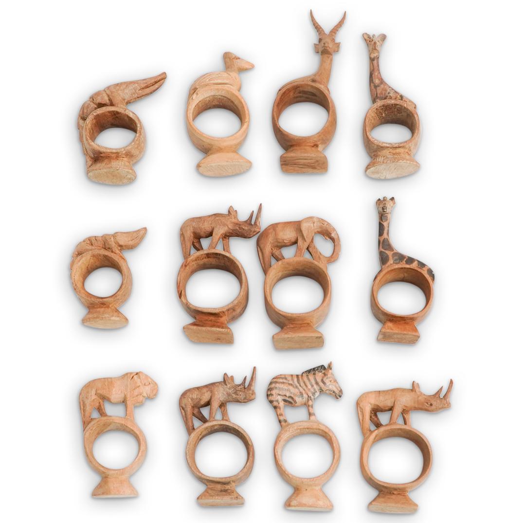 (12Pc) African Carved Wood Animal Napkin Rings: DESCRIPTION: (12Pc) A set of (12) African hand carved napkin rings with intricate safari animal designs. CIRCA: 20th Cent. ORIGIN: Africa DIMENSIONS: (Largest) D: 5.25" (Smallest) D: 3.25" CONDITION: 