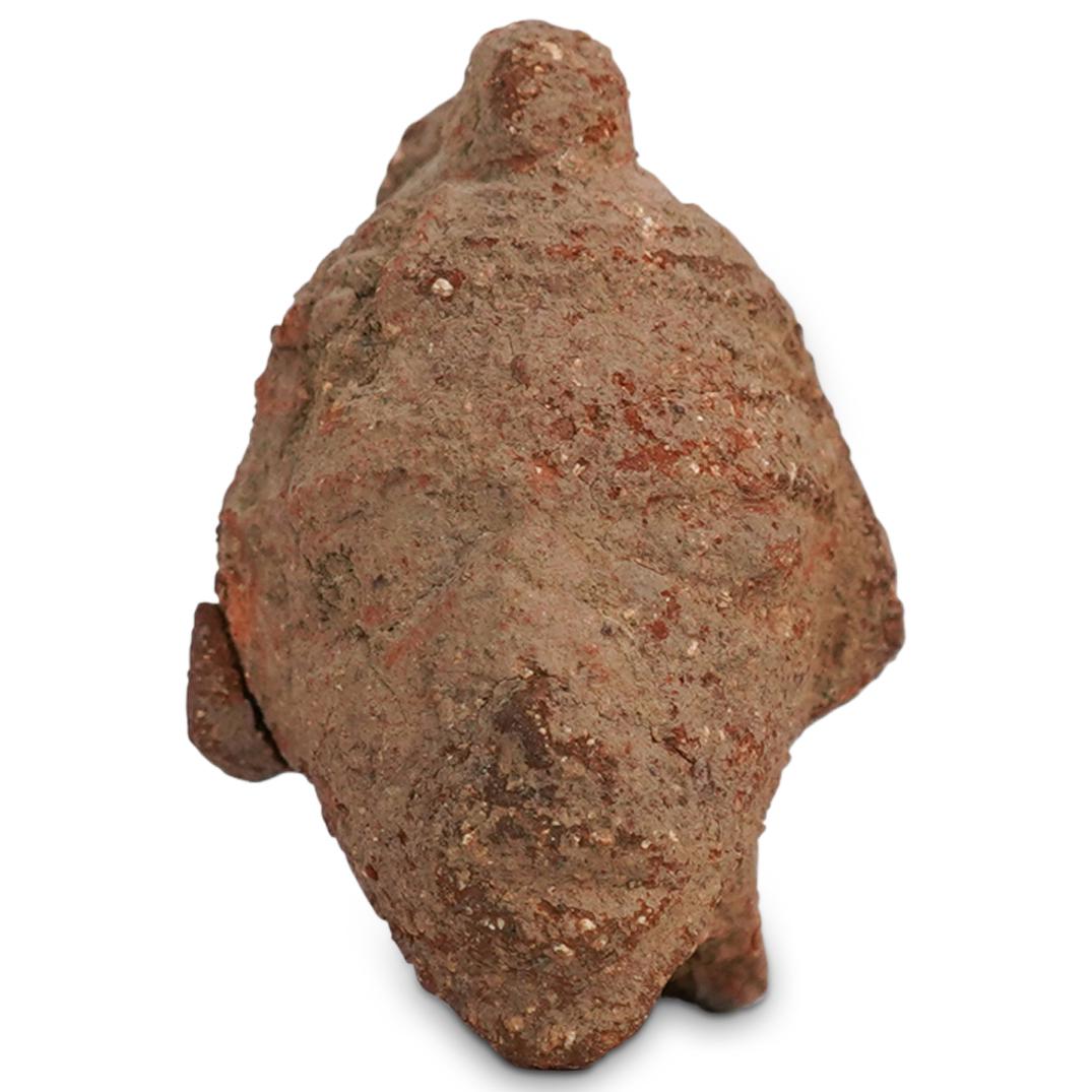 Ancient African Nok Terracotta Head: DESCRIPTION: Ancient African Nok Terracotta Head. The Nok culture produced sculptures of human heads and figures of humans and animals in terracotta, the earliest such sculpture produced in sub-Sahara