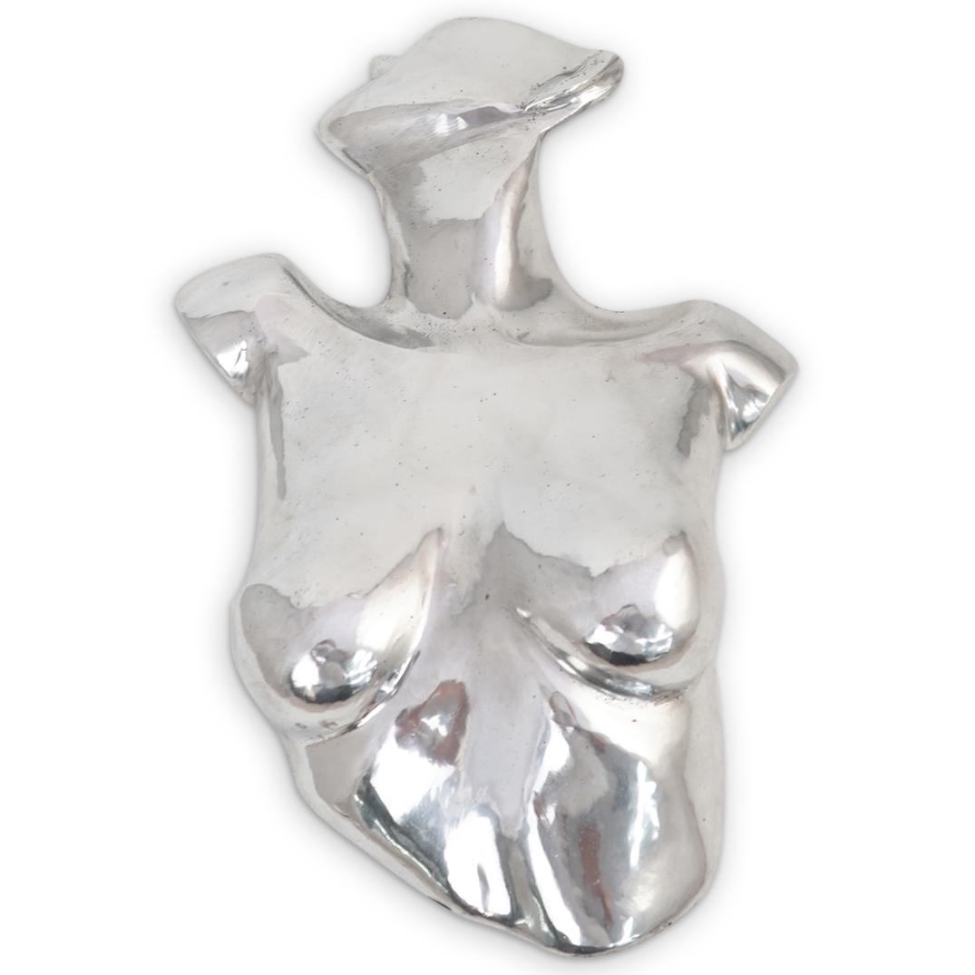Female Aluminum Torso Wall Sculpture: DESCRIPTION: Large female nude torso wall sculpture in aluminum depicting a bust and face of a female figure in a suggestive dynamic pose. CIRCA: 20th Century. ORIGIN: USA. DIMENSIONS: H: 19" W: 13". 