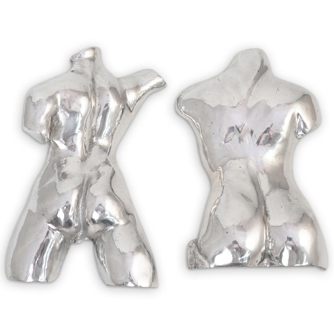 (2 Pc) Male Aluminum Torso Wall Sculptures: DESCRIPTION: (2 Pc) Pair of Male Nude Torso Wall Sculptures in aluminum depicting a nude male back side figure. CIRCA: 20th Century. ORIGIN: USA. DIMENSIONS: H: 12" W: 9". CONDITION: Good condition. S