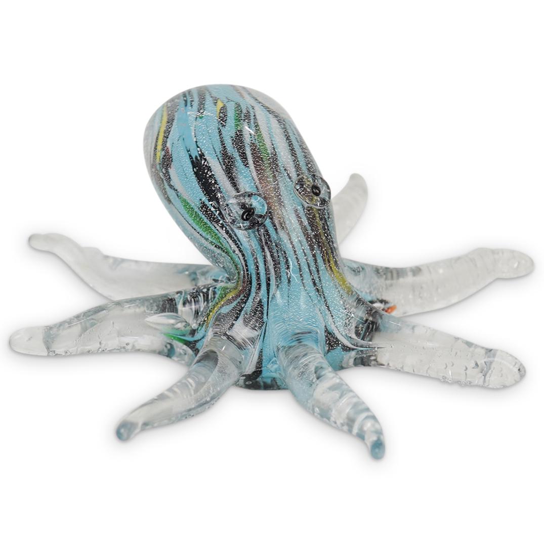 Murano Art Glass Octopus Figurine: DESCRIPTION: Murano Art Glass Octopus Figurine. Clear glass octopus shaped figurine with interior colorful design on turquoise blue, black white green and yellow glass pattern design and finished with