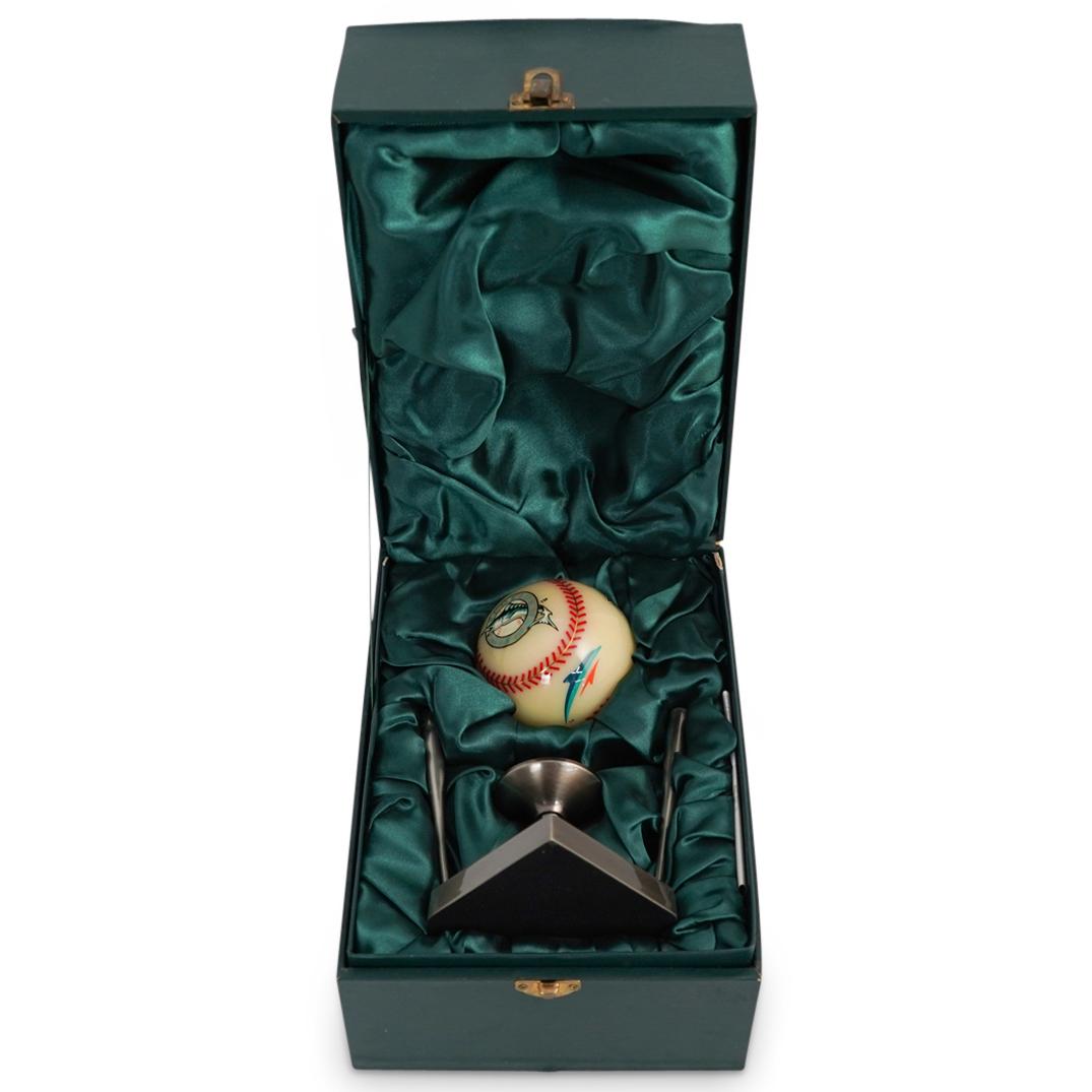 Florida Marlins Ball: DESCRIPTION: Florida Marlins Ball in Original Box. This is a three inch wide FLorida Marlins Ball with pedestal and original box. Pedestal has engraving " Dolphin Stadium Employee of the Month". CIRCA