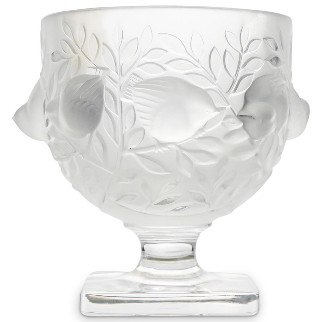 Lalique Crystal "Elizabeth" Vase: DESCRIPTION: A Lalique crystal "Elizabeth" vase. Features embossed birds, nestles along stems of branches enveloping the birds. Rests on a stem and squared base. Signed:"Lalique France". CIRCA: 20th C