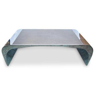 "Selina K" Louis A. Lara X Brueton Steel Coffee Table: DESCRIPTION: A modernist "Selina K" coffee table designed by Louis A. Lara for Brueton. Features a continuous planar polished steel structure with sculpted waterfall edge form. Finished with a satin