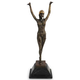 After Demetre Chiparus (Romanian,1886-1947) "Dourga": DESCRIPTION: An After Chiparus bronze sculpture titled: "Dourga" depicting a dancer with arms raised upward embellished with cold painted details, fitted atop an art deco styled marble plinth base.