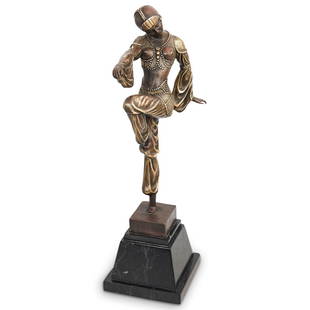 Art Deco Bronze Dancer: DESCRIPTION: An Art Deco bronze figural statue. Features the depiction of a female dancer with decorative gilt garb details. Mounted to a black marble plinth base. CIRCA: 20th Cent. ORIGIN: France