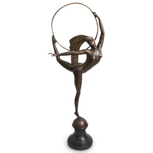 J.P. Morante Bronze Hoop Dancer: DESCRIPTION: A J.P. Morante bronze figural statue depicting a hoop dancer. Features a nude female form with a feathered headdress, supporting a large hoop. Signed "Morante" and mounted to a round