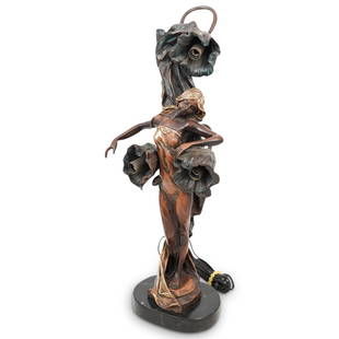 Art Nouveau Figural Bronze Lamp: DESCRIPTION: An Art Nouveau figural bronze table lamp. Features a detailed female figure with parcel gilt accents and three floral formed light sockets. Signed illegibly near base and mounted to an