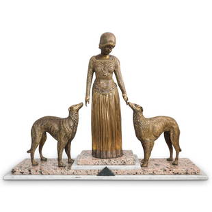 Art Deco Lady With Dogs Bronze: DESCRIPTION: An Art Deco figural bronze statue depicting a woman in ornate garb flanked by two naturalistic dogs. Completed with a gilt textured finish and mounted to a two toned marble plinth base.