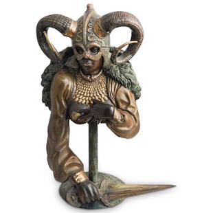 Figural Erotic Valkyrie Bronze: DESCRIPTION: A figural bronze statue depicting a valkyrie in an erotic pose. Designed with gilt accented armor, horn mounted helmet and blade in hand. Mounted to a circular base with cylindrical