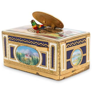 German Enamel & Gilt Metal Singing Bird Music Box: DESCRIPTION: A German Enamel Music box, The lid depicting a courting couple in a rural landscape, concealing the singing bird, the sides decorated with landscape vignettes, impressed EB marked