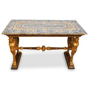 Italian Figural Gilt Carved Pietra Dura Top Table: DESCRIPTION: An Italian Pietra Dura table with figural gilt carved base. Table base features double figural winged goddesses with animal paw footed supports. Further designed with carved openwork