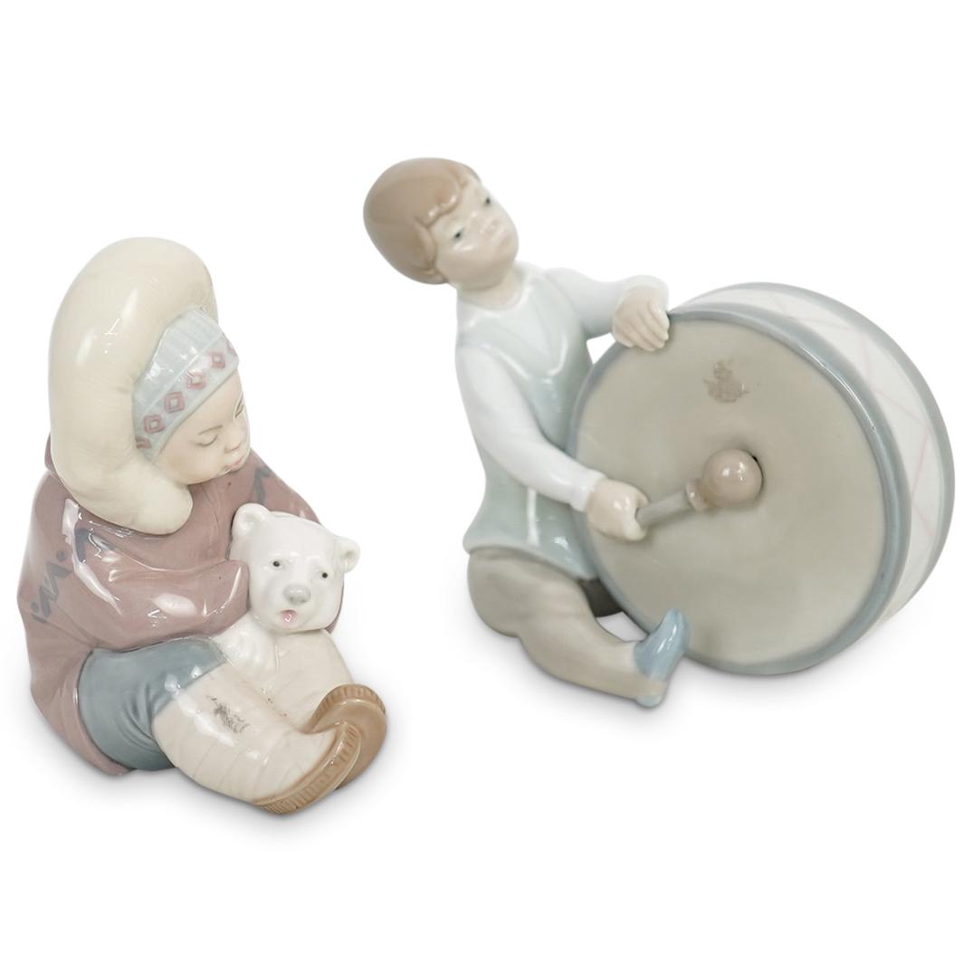 (2 Pc) A Pair of Lladro Porcelain Figurines: DESCRIPTION: (2 Pc) A Pair of Lladro porcelain figurines. Each of them marked "LLadro" "Made in Spain". Set includes: (1 Pc) A Lladro "Boy Playing Drum" Porcelain Figurine. Model number 4616. H: 4 1/2