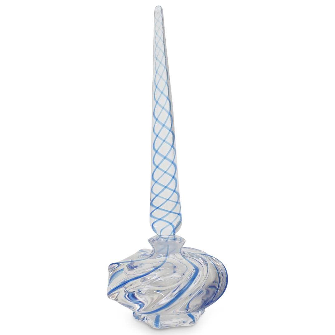 Murano Art Glass Perfume Bottle: DESCRIPTION: A Murano Art Glass Perfume Bottle with tall stopper, further decorated with a blue swirl motif. CIRCA: 20th Century. ORIGIN: Italy. DIMENSIONS: H: 9 1/2" W: 4". CONDITION: Good condition.