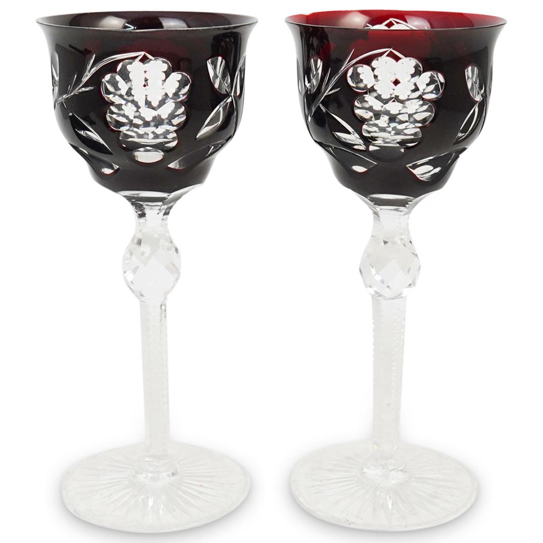 Pair of Bohemian Red Glass Wine Glasses: DESCRIPTION: (2 Pc) A Pair of Bohemian Red Cut to Clear Glass Wine Chalices. CIRCA: 20th Century. ORIGIN: Czech Republic. DIMENSIONS: H: 8" W: 3 1/2". CONDITION: Vintage condition. Minor color chip on