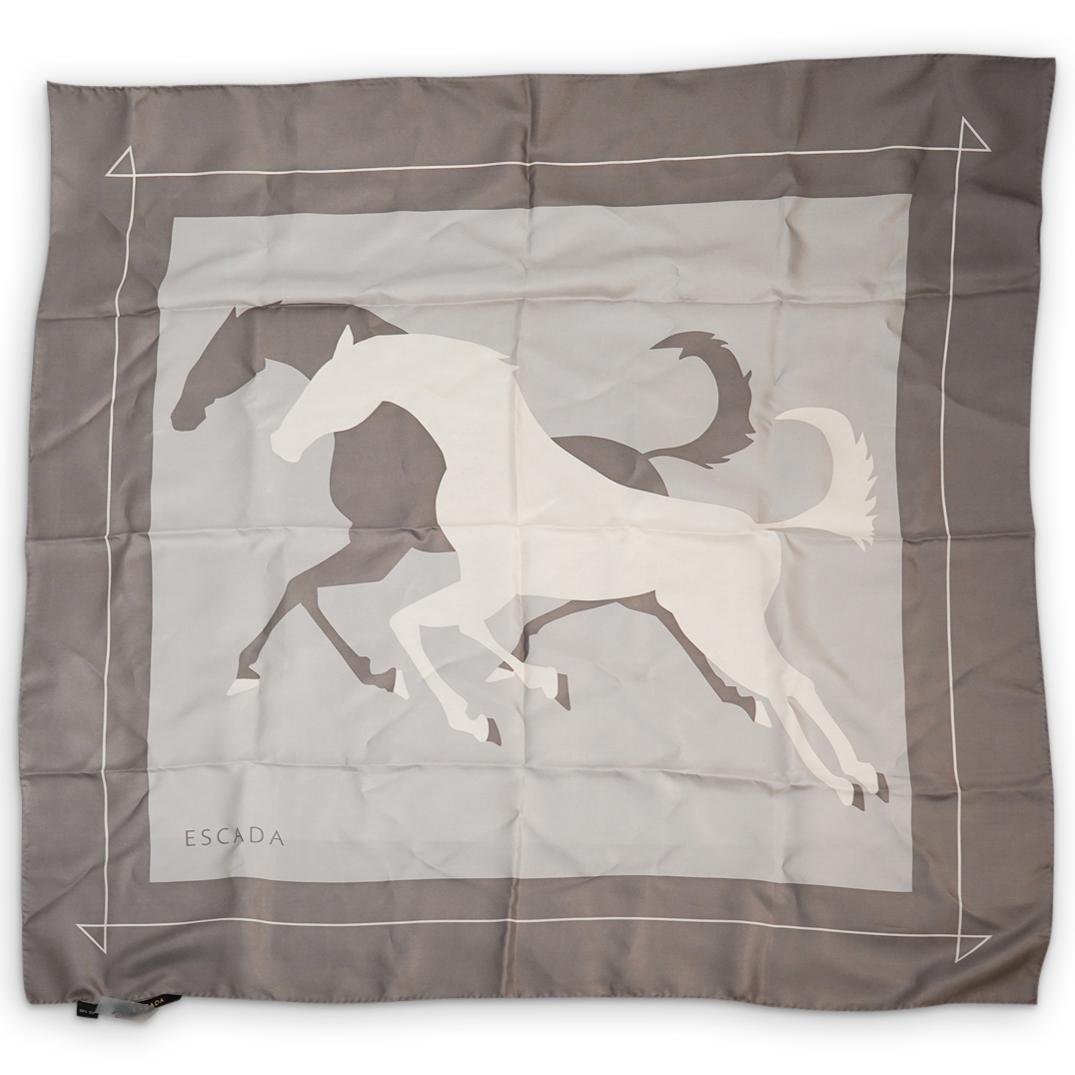 Escada Silk Scarf: DESCRIPTION: Escada Silk Scarf in grey, silver and beige colors depicting a pair of running horses as a central motif. The square silk scarf bears the "Escada" mark on bottom left side and a Escada se