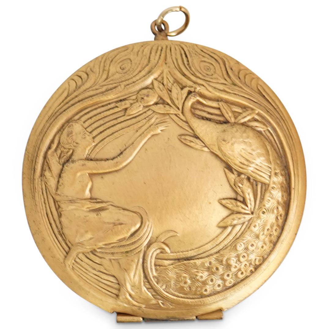 Art Nouveau Style Pendant Locket: DESCRIPTION: An Art Nouveau Style Gold Gilt Pendant Locket decorated with a female figure and pheasant relief motif. CIRCA: 20th Century. DIMENSIONS: W: 2 1/8". CONDITION: Good condition. See lot desc