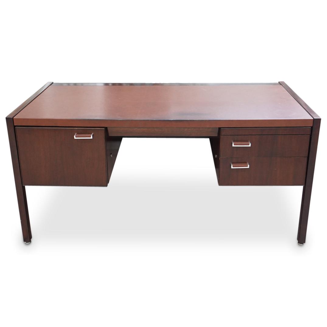 Herman Miller X Eames Task Desk: DESCRIPTION: A Herman Miller for Charles Eames task desk. Features a wood foundation with leather wrapped top. Designed with a single pull-out file drawer, slim center drawer, and two stacked storage