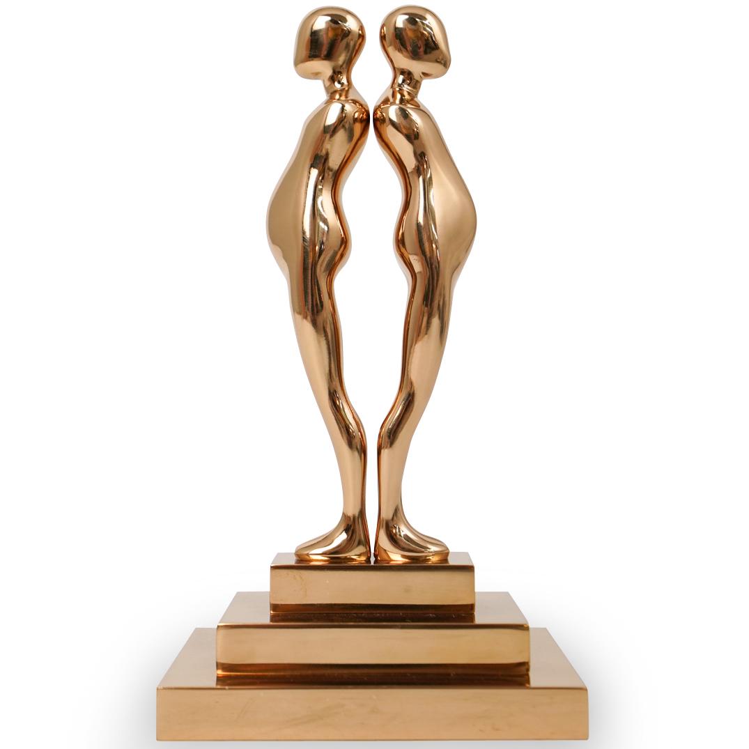 Ernest Trova (American.1927-2009) "Double Study Man": DESCRIPTION: A sculpture by American surrealist Ernest Trova titled double study man sculpture, composed of polished bronze in gilded tones. Engraved with Trova mark, Numbered "95/99" and dated "1986"