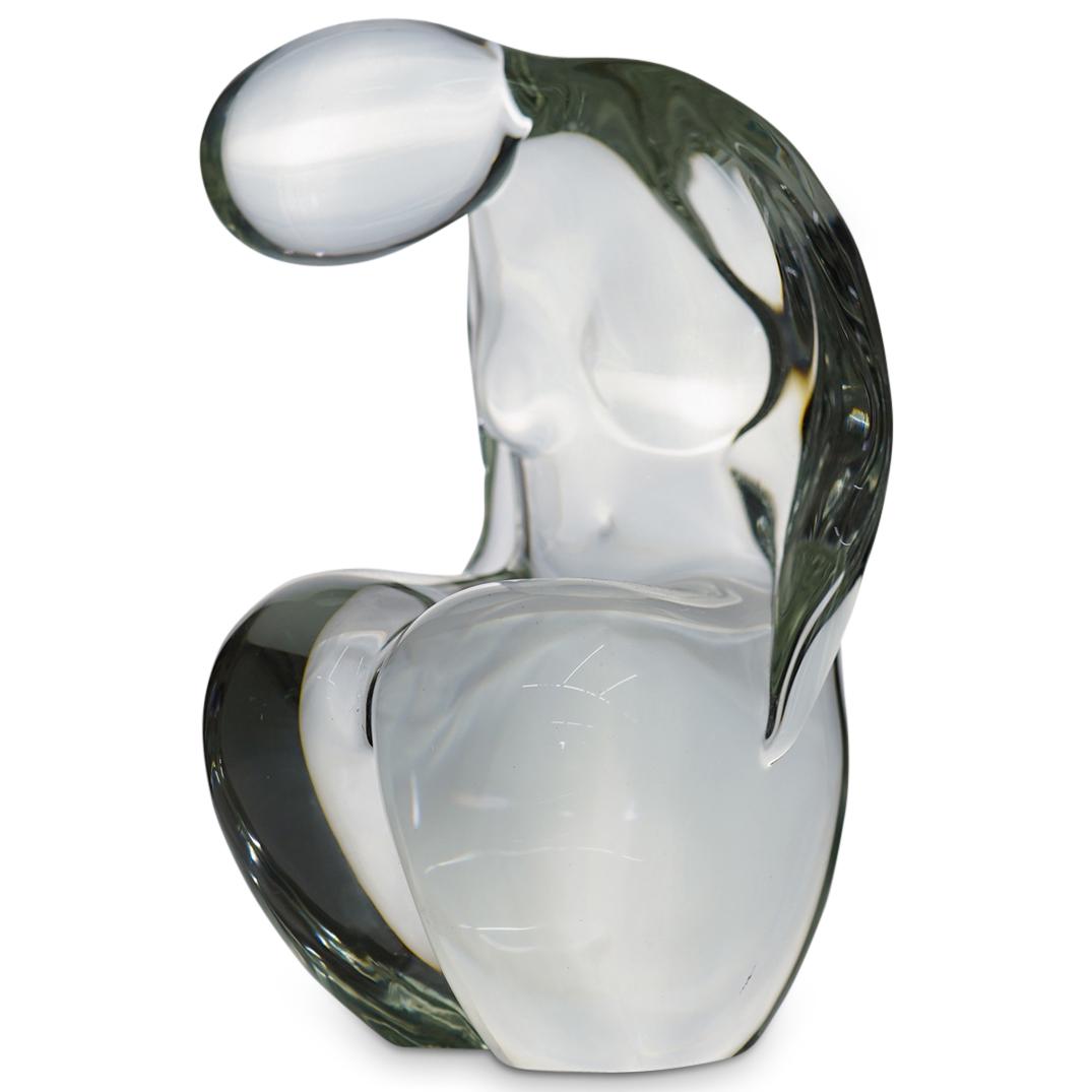 Elio Raffaeli Murano Glass Sculpture: DESCRIPTION: A Murano Glass sculpture depicting a nude figure, incised along the underside "Elio Raffaeli" and has Oggetti sticker. CIRCA: 20th Cent. ORIGIN: Italy DIMENSIONS: H: 11" W: 7" CONDITION: