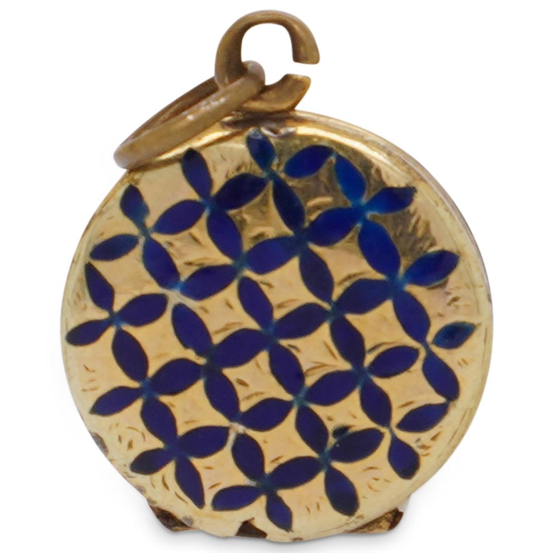 Antique Gold Filled and Enamel Locket: DESCRIPTION: An antique gold Filled locket decorated along the front with a blue enamel lattice pattern, opens revealing a glass compartment. CIRCA: 20th Cent. ORIGIN: European DIMENSIONS: Diameter: .