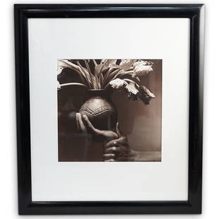 Len Prince (American, B. 1953) " Vessel in Hand": DESCRIPTION: Len Prince (American, B. 1953) " Vessel in Hand" Photograph. Depicting a black/white rendition of a hand holding a flower vase. Pencil signed on the back " 5/10, 1990" Embossed lower righ