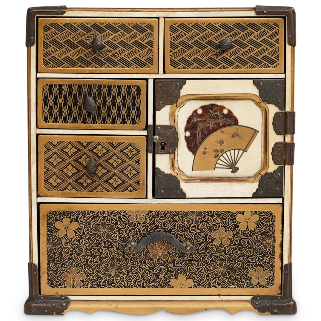Japanese Meiji Lacquer Kodansu: DESCRIPTION: A Japanese Kodansu from the Meiji period composed of a Laquered wood and carved bone frame, decorated along the front with various gilt decorations depicting repeating shapes and floral p