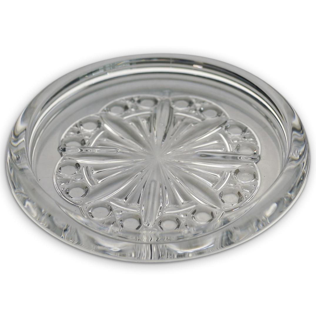 Baccarat Crystal Wine Coaster: DESCRIPTION: A Baccarat crystal wine coaster features in a clear foundation, decorated with geometric. Marked along the underside with Baccarat seal. Includes original box and pamphlet. CIRCA: 20th Ce