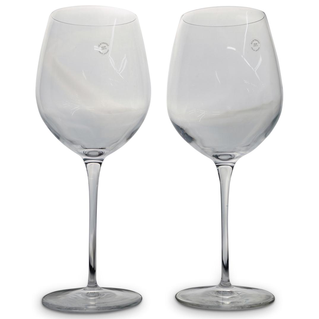 Pair Of Tiffany and Co. Wine Glasses: DESCRIPTION: A pair of Tiffany and Co. wine glasses, sticketed "Made In Italy Crystal" and etched "Tiffany and Co.". Comes with original boxes CIRCA: 20th Cent. ORIGIN: Italy DIMENSIONS: H: 9.25" W: 3