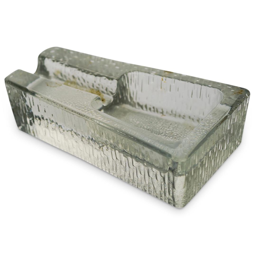 Vintage Glass Cigar Ashtray: DESCRIPTION: A vintage clear glass cigar ashtray with raised textured exterior. CIRCA: 20th Cent. ORIGIN: Continental DIMENSIONS: H: 2.25" x W: 4.25" x L: 7.25" Have a similar item to sell? Contact: I