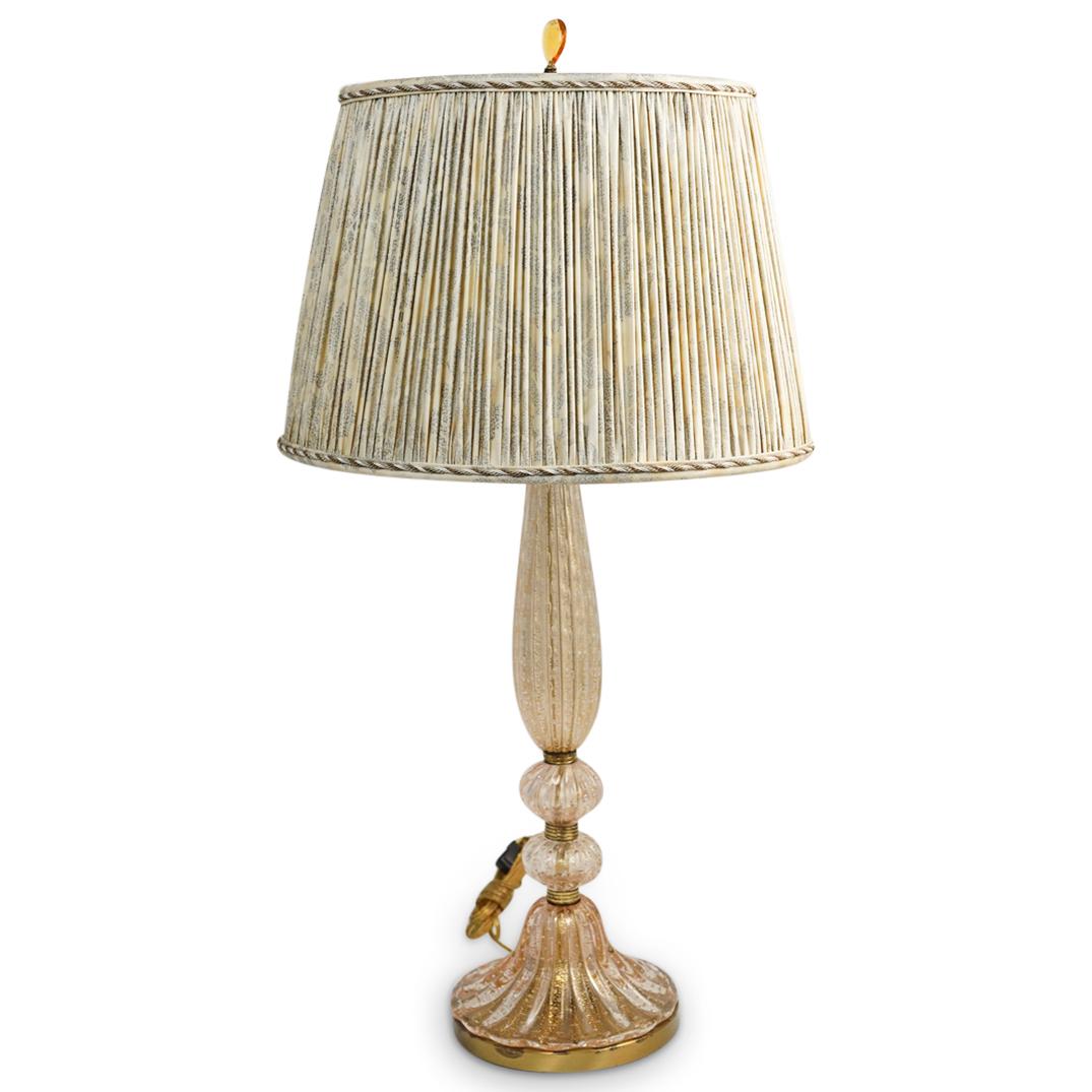Seguso Murano Glass Gold Flaked Lamp: DESCRIPTION: A Seguso Murano glass lamp features a multi tier glass stem divided with brass fittings, the glass stem embellished with vertical grooves and beautifully decorated with gold flakes. In wo