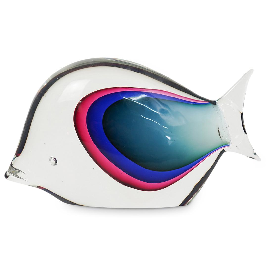 Murano Art Glass Fish Sculpture: DESCRIPTION: A Murano art glass fish sculpture. This is a hand blown glass sculpture with the shape of a fish in clear glass with interior green, blue and magenta glass accent design. (Ref. F01). CIRC