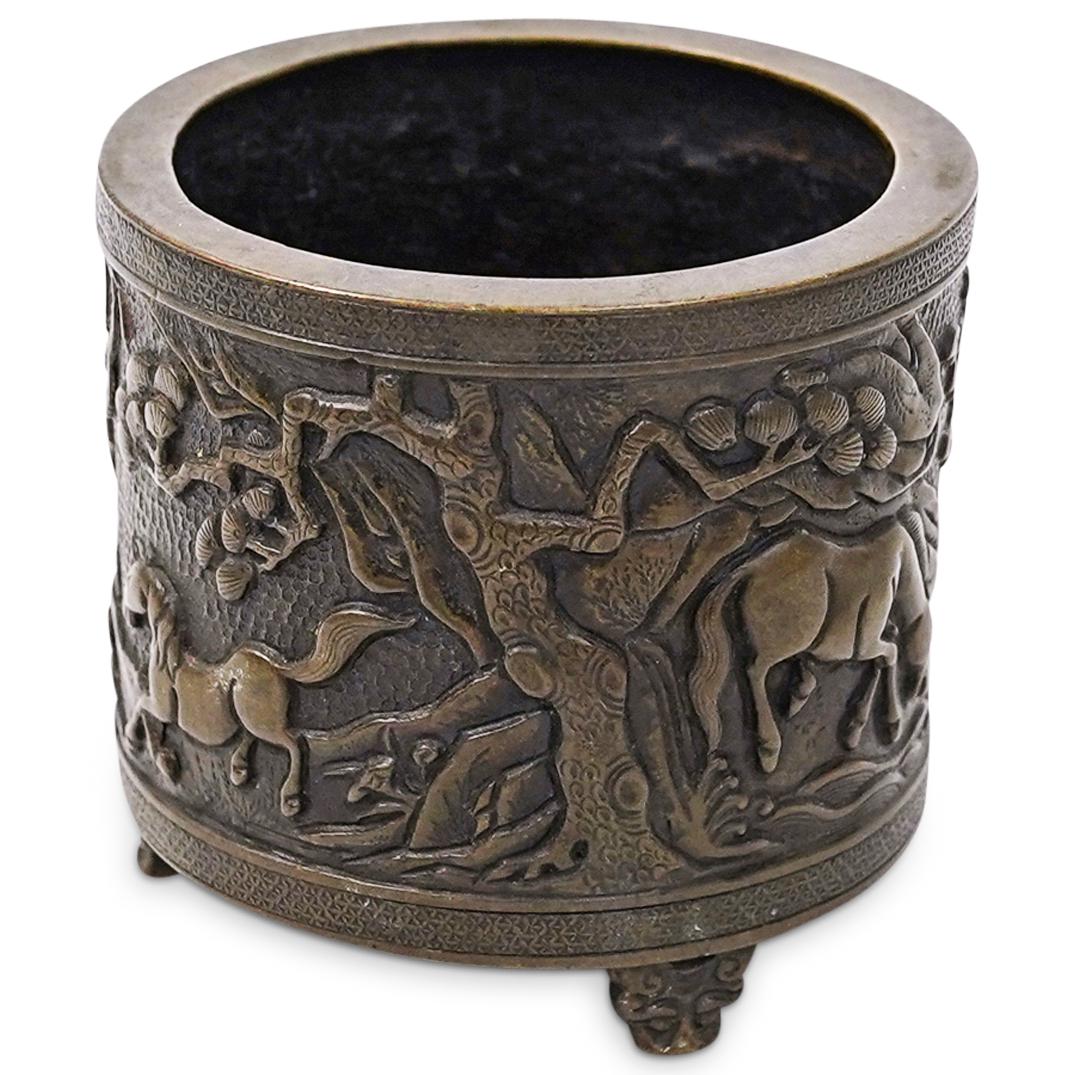 Chinese Hu Wen Ming Zhi Bronze Censer: DESCRIPTION: An antique Chinese Hu Wen Ming Zhi cylindrical bronze censer with horse and tree reliefs. Finished on three figural decorated feet, Hu Wen Ming Zhi marking underneath. CIRCA: 20th Cent. P