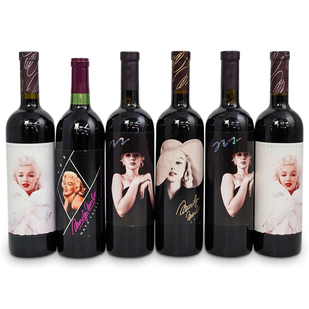 (6 Bottles) "Marilyn Monroe" Wine Bottles Grouping: DESCRIPTION: (6 Bottles ) A "Marilyn Monroe" Wine Bottles Grouping Set. This set includes: two (2) Marilyn Monroe 1995 Napa Valley Merlot wine bottles, two (2) Marilyn Monroe 1996 Napa Valley Merlot w