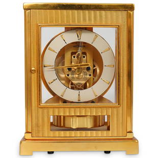 Lecoultre Atmos Moderne The Perpetual Motion Clock: DESCRIPTION: A Lecoultre Atmos Moderne The Perpetual Motion Clock. This is a gilt brass unique mantle clock designed by Atmos with a sealed capsule, were a mixture of gases expand and contract with ea