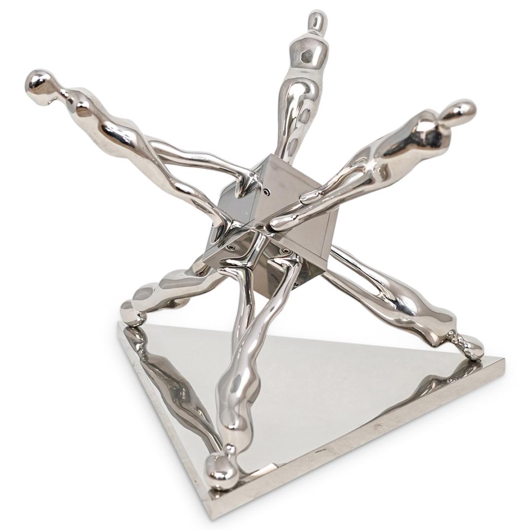 Ernest Trova "Walking Jackman" Chromed Steel Sculpture: DESCRIPTION: A sculpture by surrealist artist Ernest Trova composed of Chromed steel titled "Walking Jackman". Marked along the bottom Edition "61 of 99" and dated 1986 with Trova stamp. Comes with ar