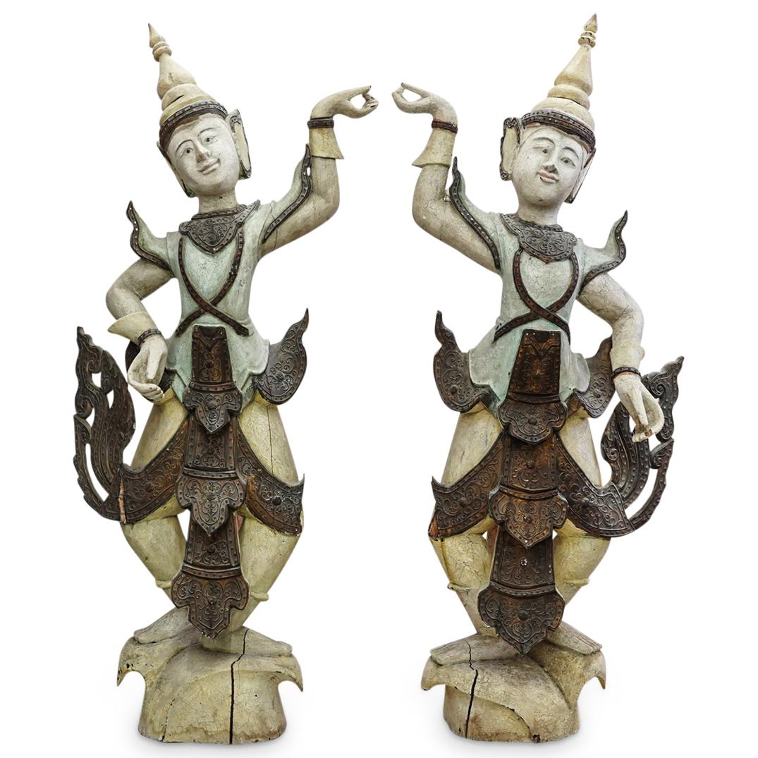 Balinese Wood Carved Dancers: DESCRIPTION: A Pair of Balinese wood carved dancers decorated with polychrome accents. CIRCA: 20th Century. ORIGIN: Bali DIMENSIONS: H: 46.5" W: 19" Have a similar item to sell? Contact: Info@Akibaant