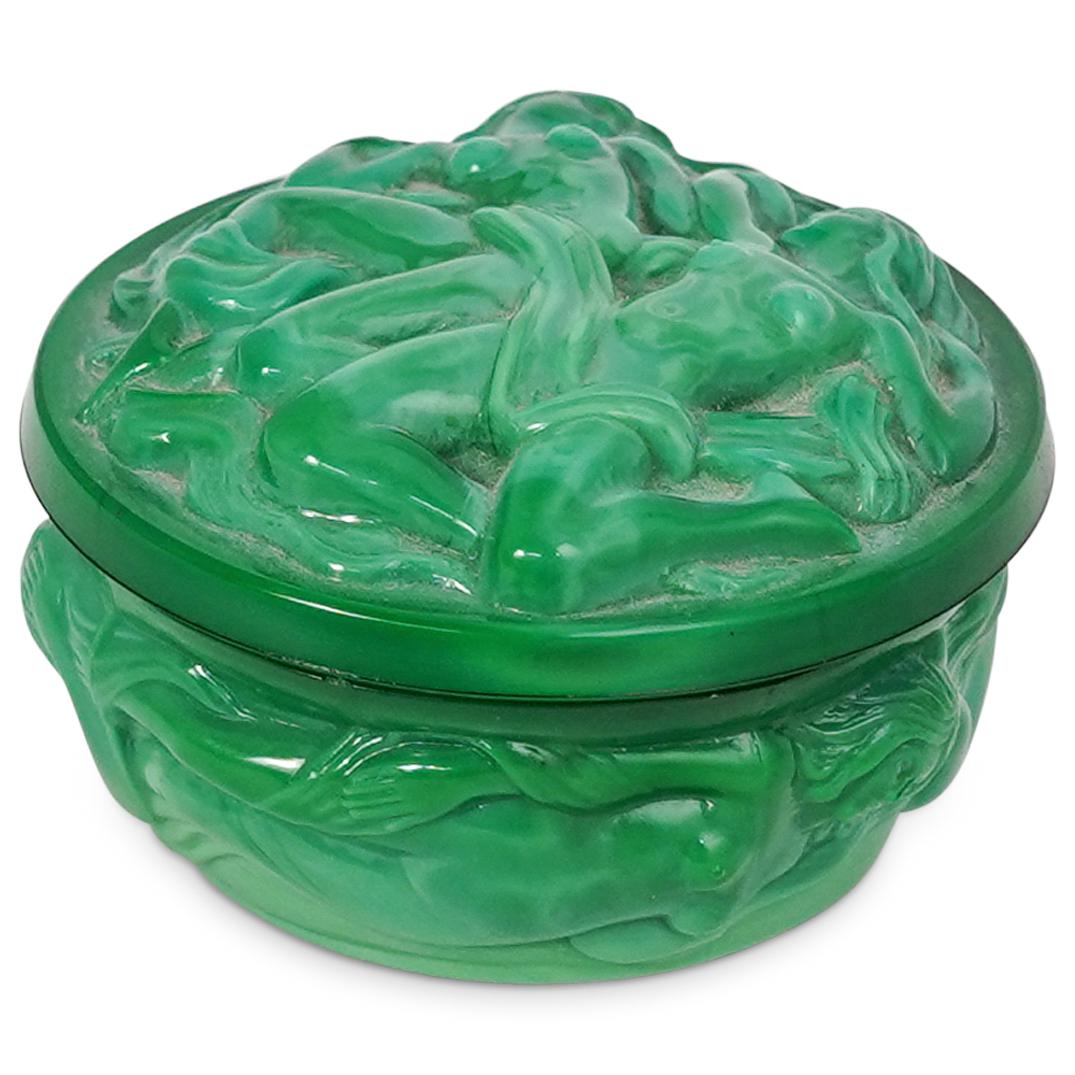 Malachite Glass Nymphs Lidded Box: DESCRIPTION: A Czech bohemian malachite green glass round lidded jewelry box embellished with carved decorative motifs depicting nude female nymphs. CIRCA: 20th Century. ORIGIN: Czech Republic. DIMENS