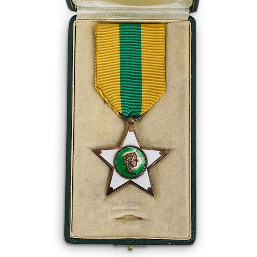 Al Merito Del Lavoro Medal: DESCRIPTION: Al Merito Del Lavoro (1924) Features a five pointed star center figural relief and white accented enamels and green striped yellow ribbon. Marked: "Al Merito Del Lavoro, 1924" original ca